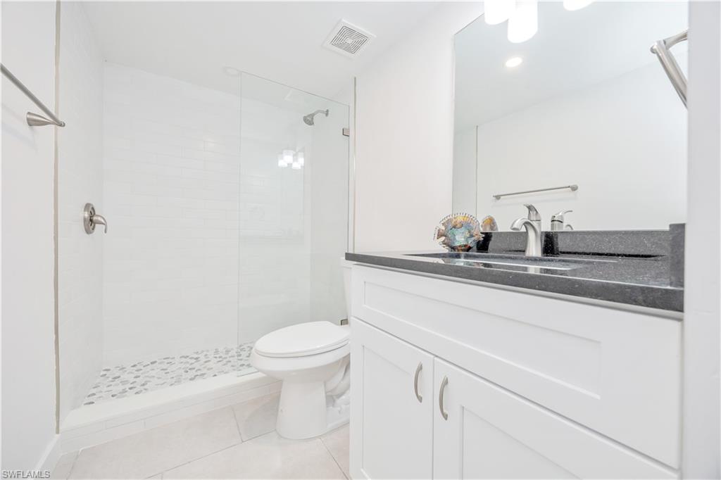 4180 Crayton Road, Unit E4 Naples, FL 34103 - Photo 20 of 25 Second Bathroom w/walk in shower