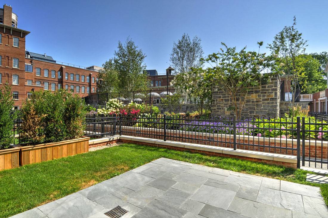 35 Church Street Sag Harbor, NY 11963 - Photo 2 of 16 a view of a backyard with a garden