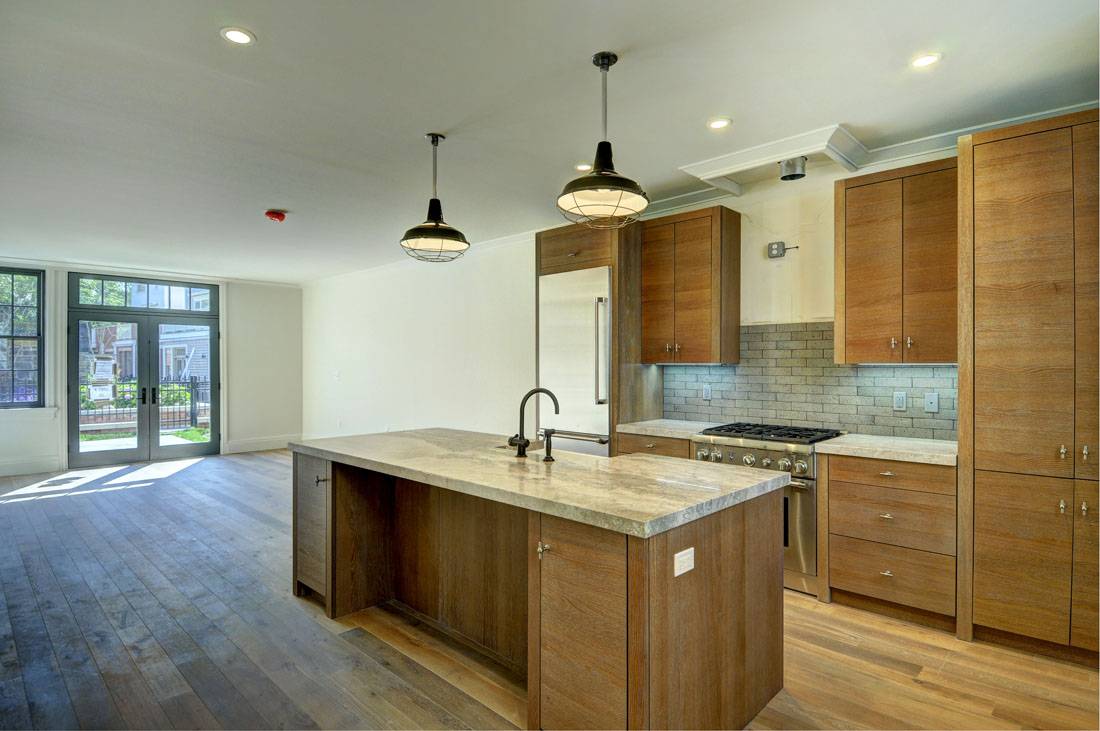 35 Church Street Sag Harbor, NY 11963 - Photo 3 of 16 a kitchen with a sink a counter space and stainless steel appliances