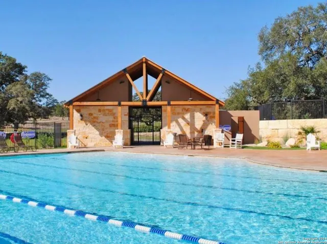 a view of a lake with houses in the back