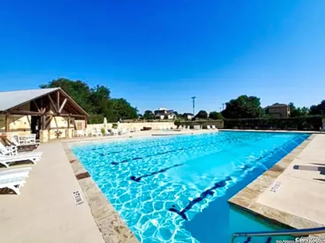 a view of a lake with houses in the back