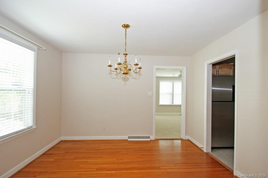 6723 Old Reid Road Charlotte, NC 28210 - Photo 4 of 7 a view of an empty room with window and wooden floor