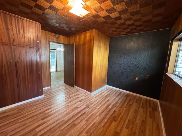 a view of hallway with wooden floor