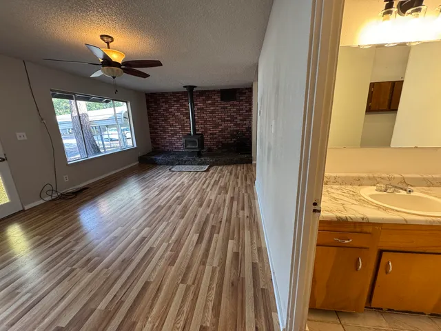 a bathroom with a shower and a sink