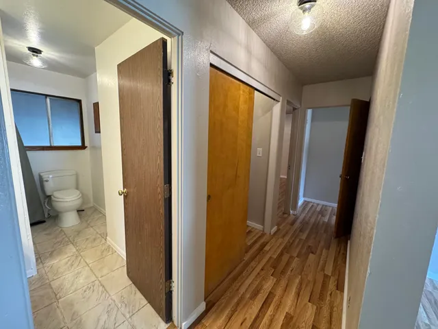 a view of room with wooden floor and window