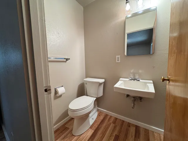 a view of gallery with wooden floor