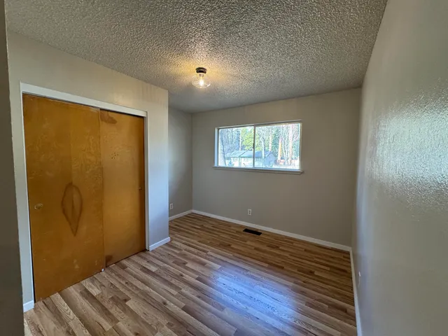 a view of a backyard with wooden floor