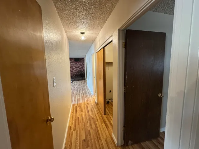 a backyard of a house with barbeque oven table and chairs