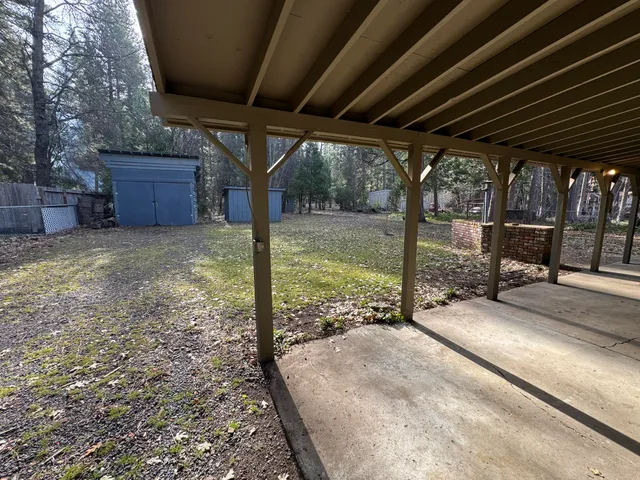 a front view of house with yard and trees
