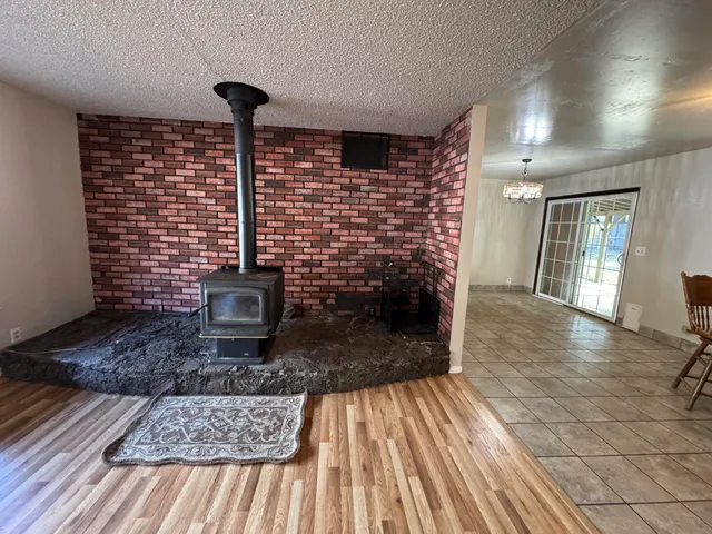 a view of a hallway view with wooden floor and staircase