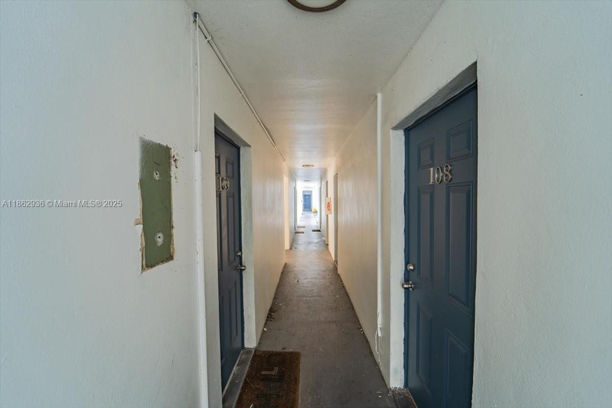 13201 Memorial Highway North Miami, FL 33161 - Photo 11 of 35 a view of a hallway with wooden floor