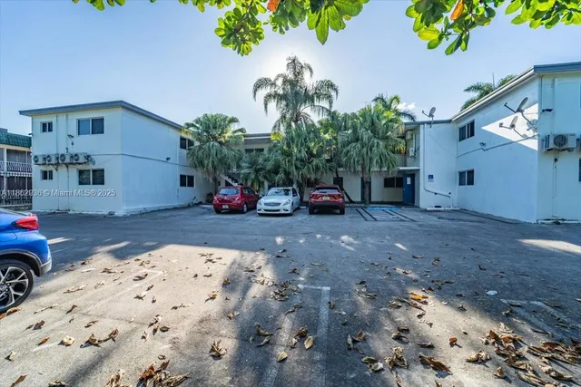 a front view of a house with parking area