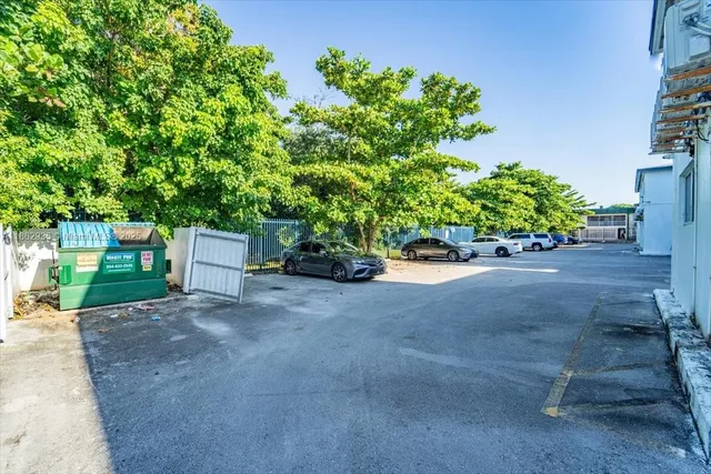 a view of street with parked cars