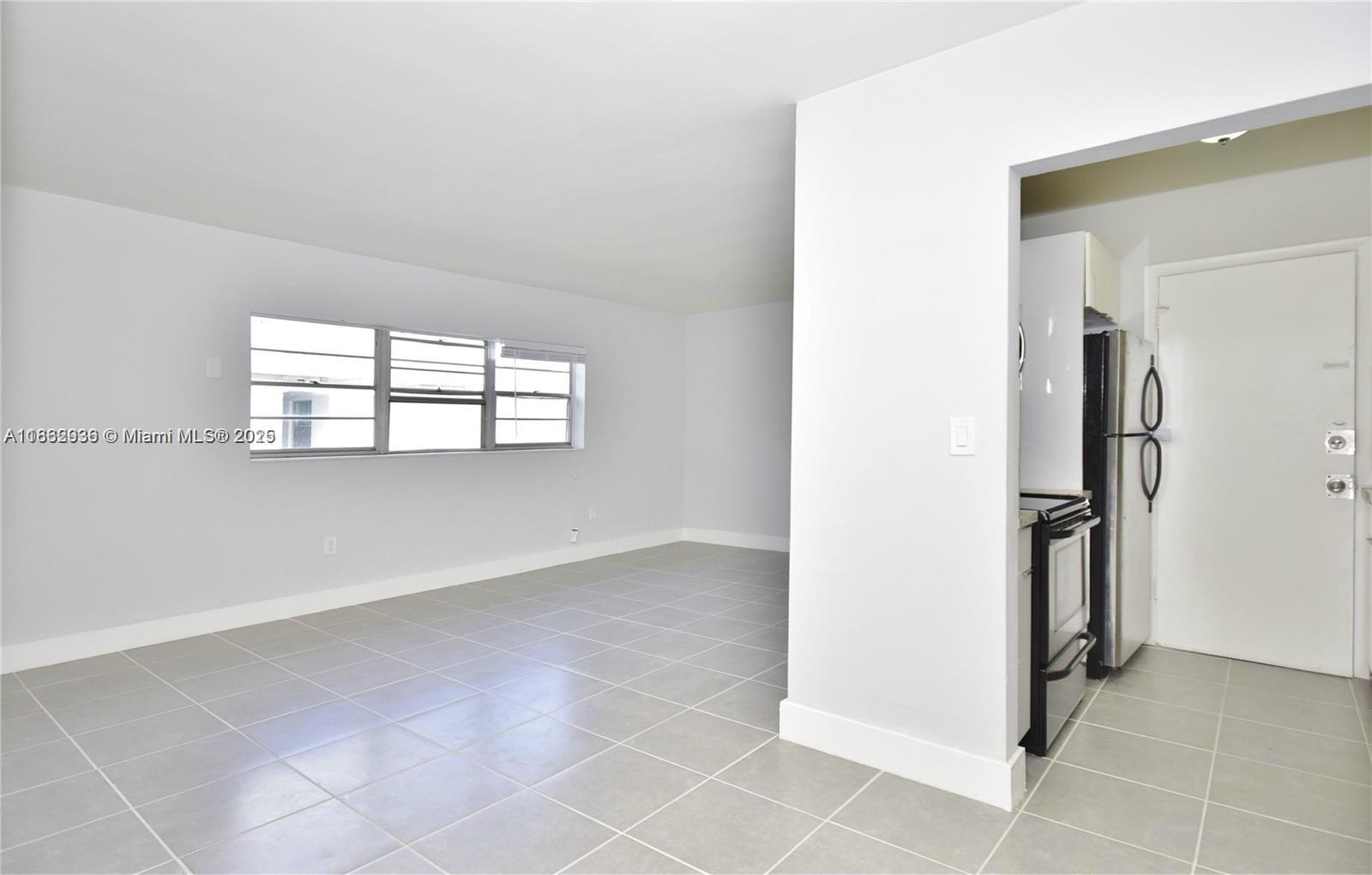 13201 Memorial Highway North Miami, FL 33161 - Photo 2 of 35 an empty room with windows