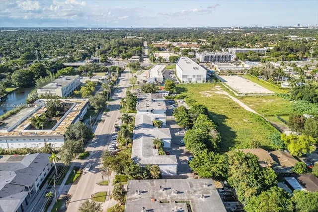 an aerial view of residential houses with outdoor space