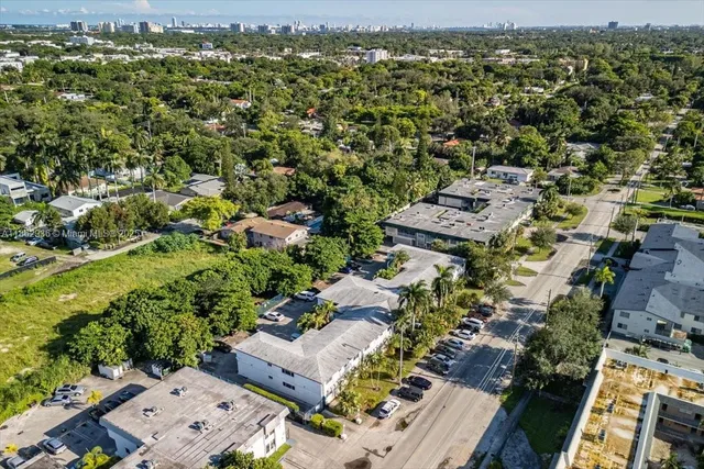 an aerial view of a house with a yard and a garden