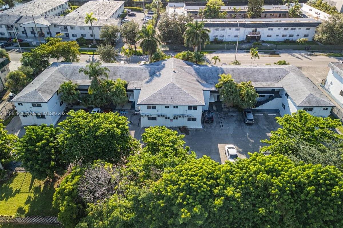 13201 Memorial Highway North Miami, FL 33161 - Photo 33 of 35 an aerial view of a house with a garden and lake view