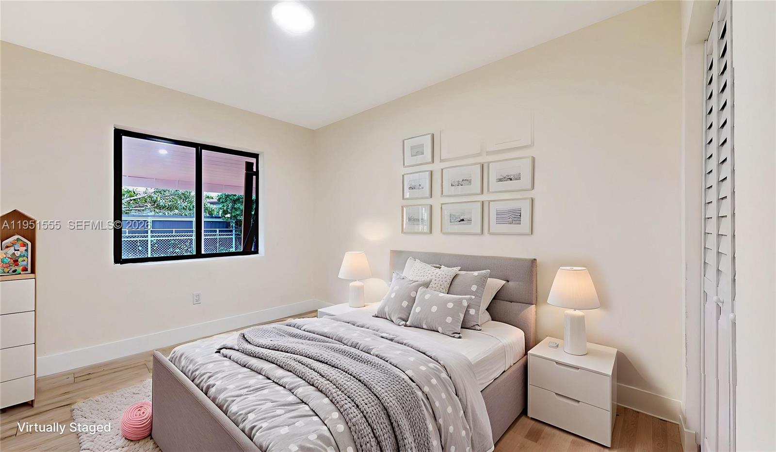 10944 Southwest 159th Terrace Miami, FL 33157 - Photo 15 of 25 a bedroom with a bed and a window
