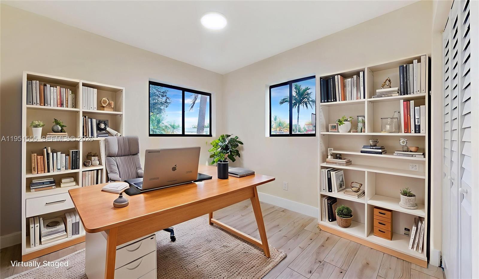 10944 Southwest 159th Terrace Miami, FL 33157 - Photo 17 of 25 a work room with furniture bookshelf and a window