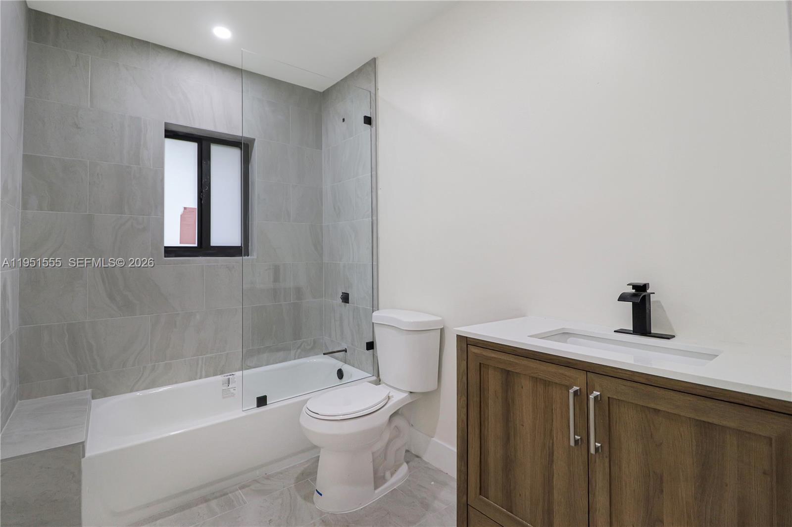 10944 Southwest 159th Terrace Miami, FL 33157 - Photo 19 of 25 a bathroom with a sink a toilet and shower