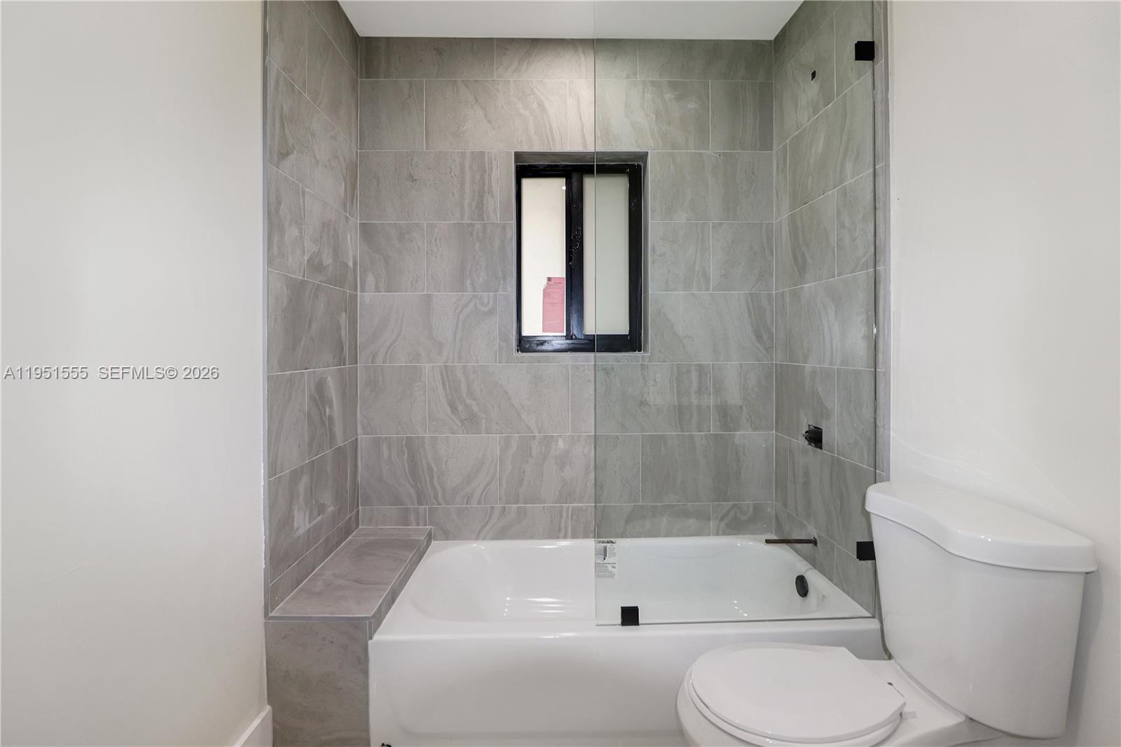 10944 Southwest 159th Terrace Miami, FL 33157 - Photo 20 of 25 a bathroom with a toilet bathtub and shower