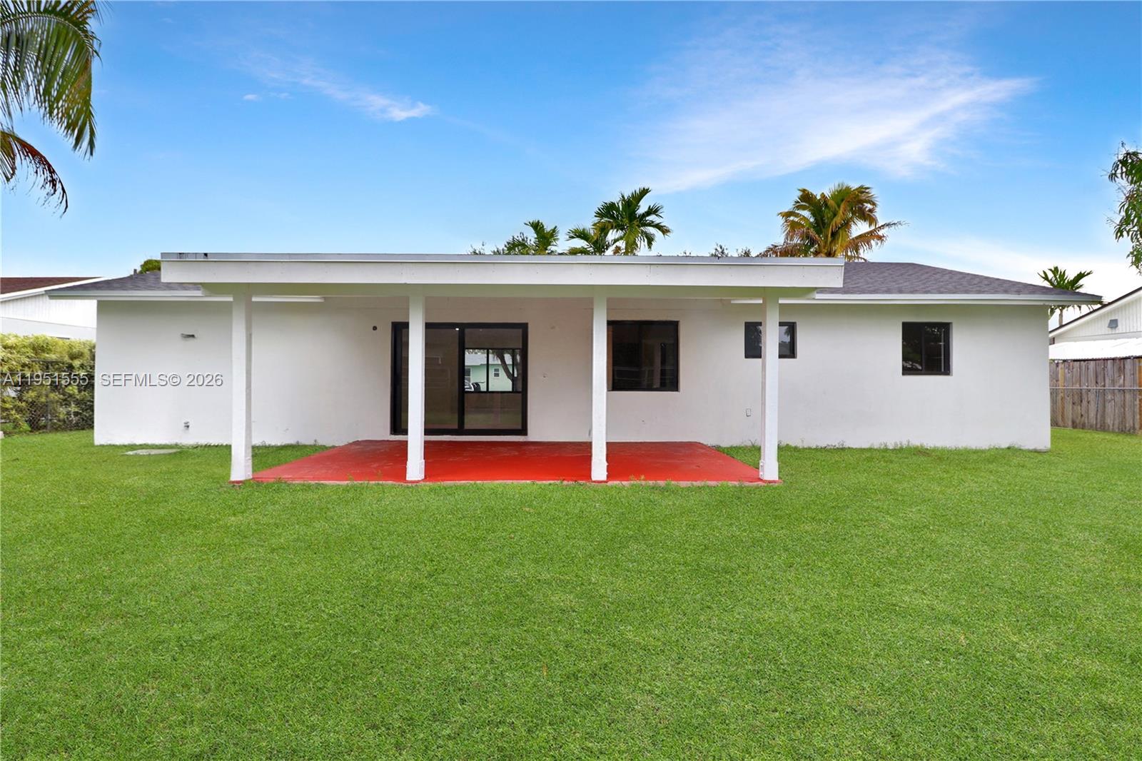 10944 Southwest 159th Terrace Miami, FL 33157 - Photo 2 of 25 a view of a house with a yard and porch