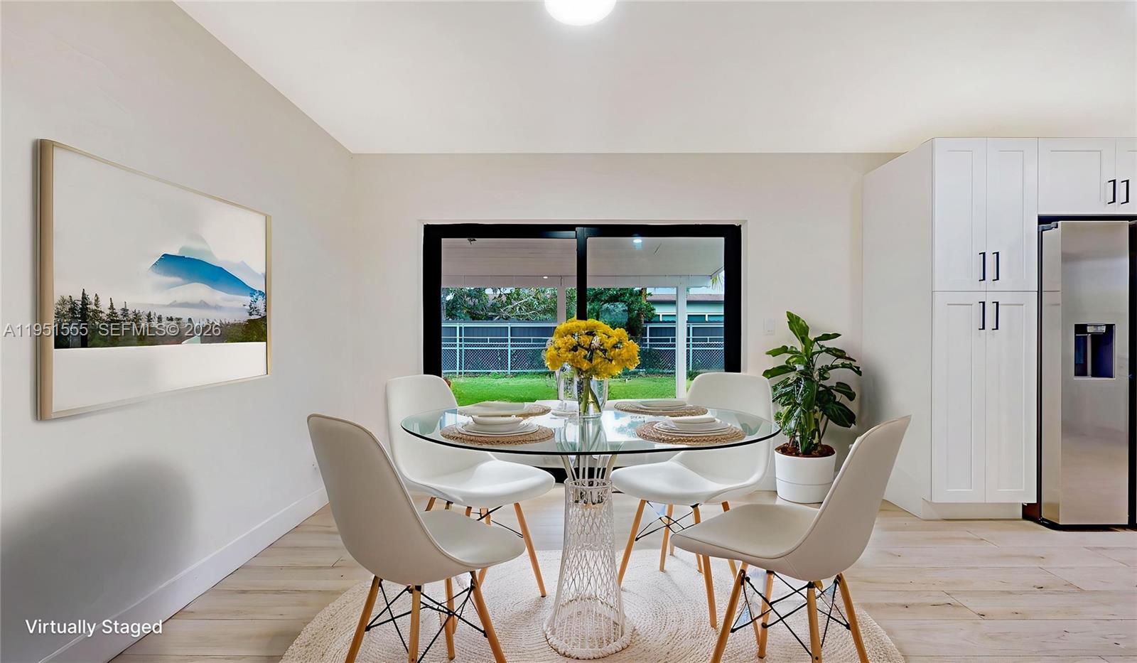 10944 Southwest 159th Terrace Miami, FL 33157 - Photo 10 of 25 a dining room with furniture and window