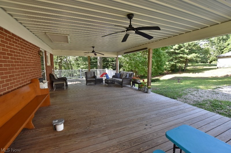 5007 Raven Road Southeast Carrollton, OH 44615 - Photo 8 of 50 Nice large covered portion of the wrap around deck for outdoor living and entertaining