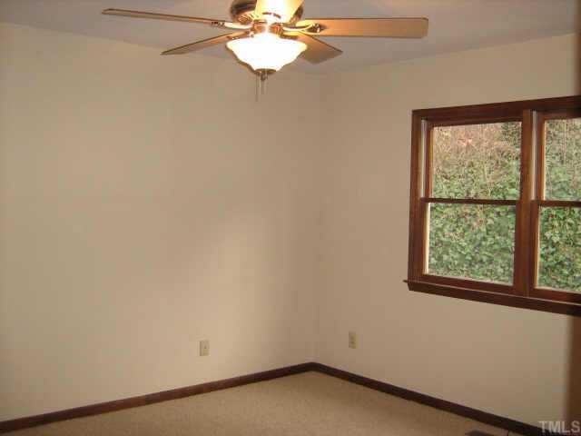 1108 Bahama Road Bahama, NC 27503 - Photo 5 of 10 an empty room with a window