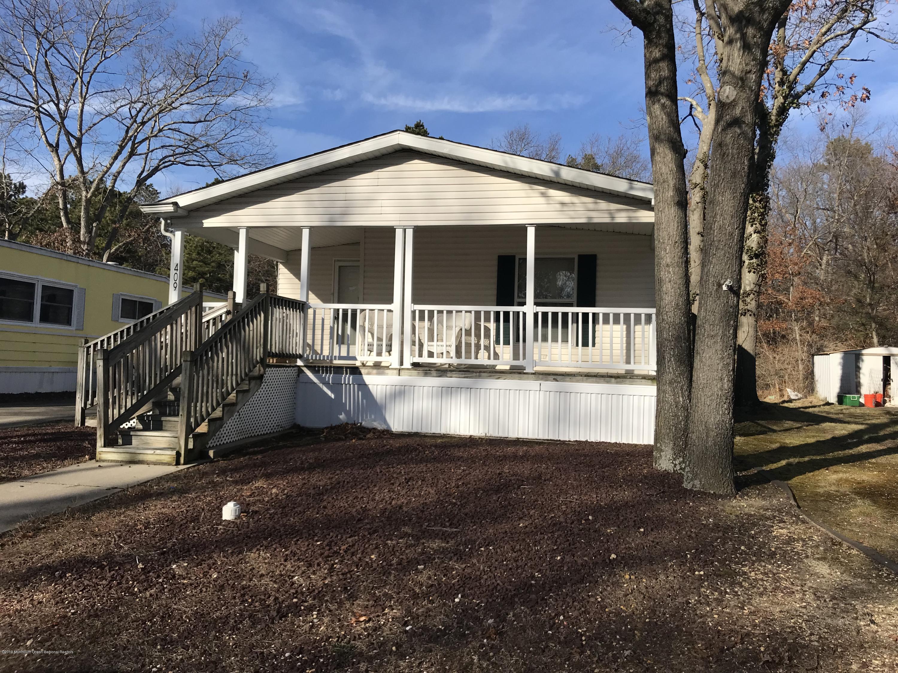 409 Roberts Road Toms River, NJ 08755 - Photo 1 of 34 a front view of a house with a yard