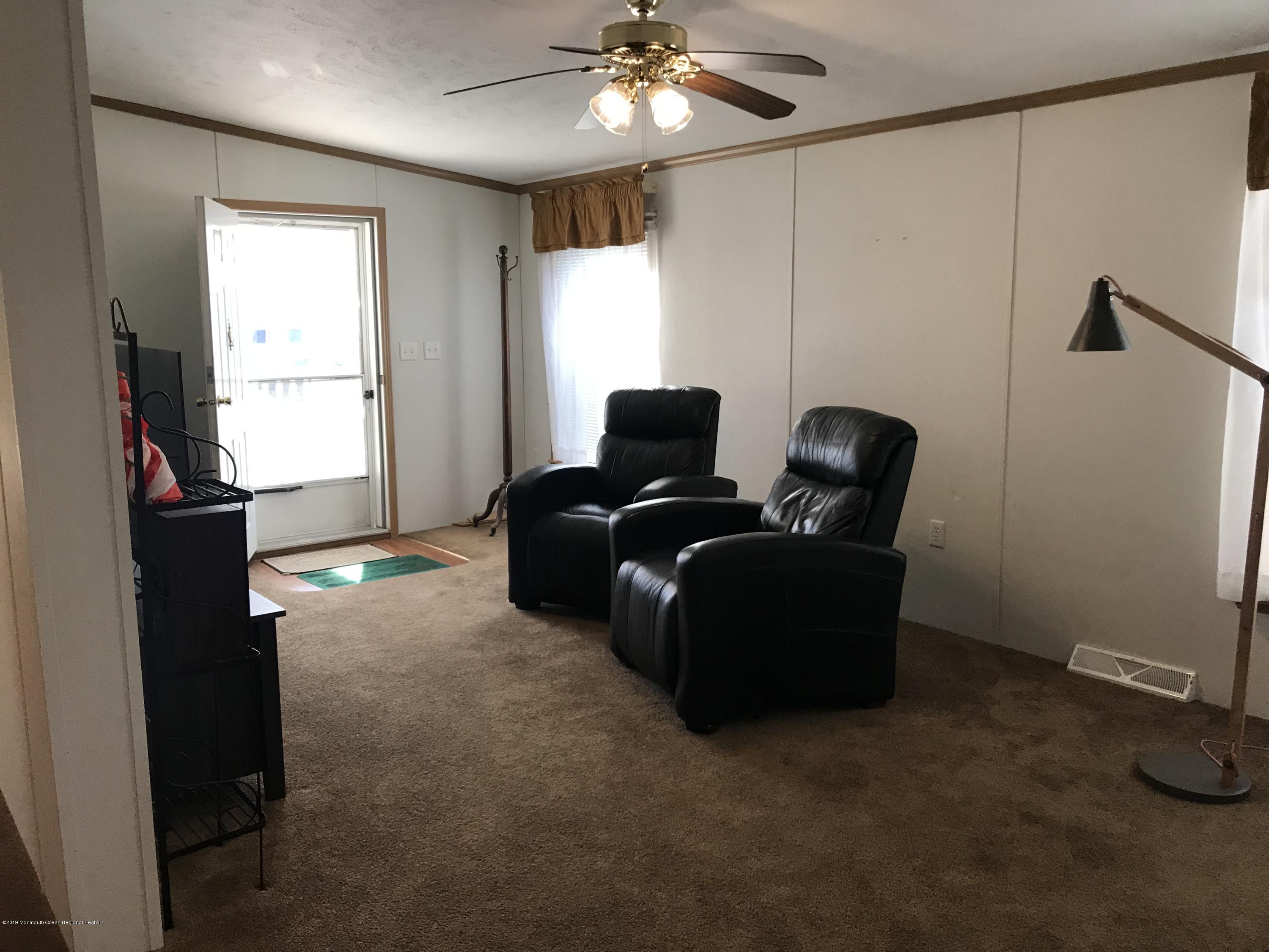409 Roberts Road Toms River, NJ 08755 - Photo 5 of 34 a living room with furniture and a window