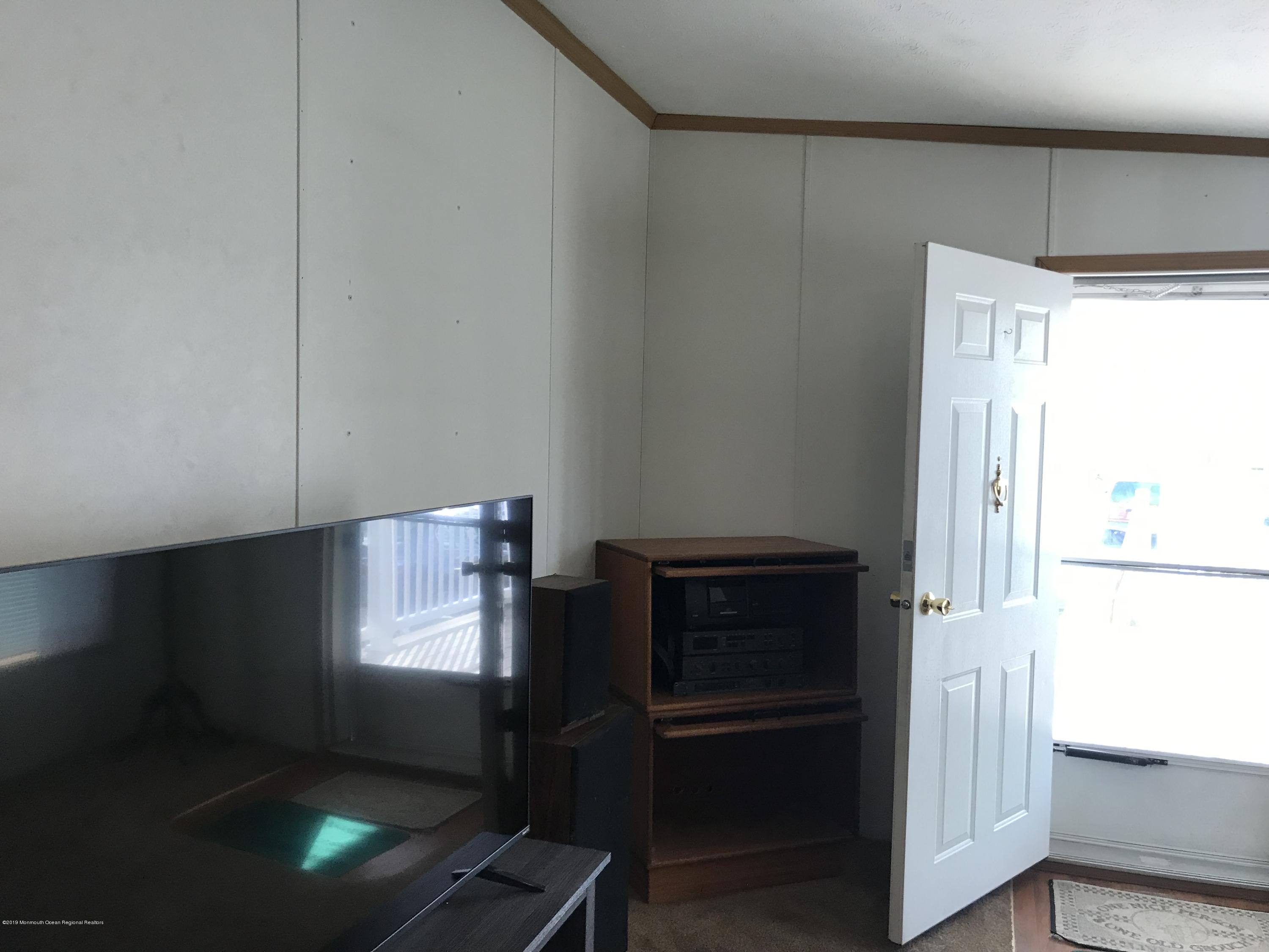 409 Roberts Road Toms River, NJ 08755 - Photo 6 of 34 a kitchen with appliances and a window
