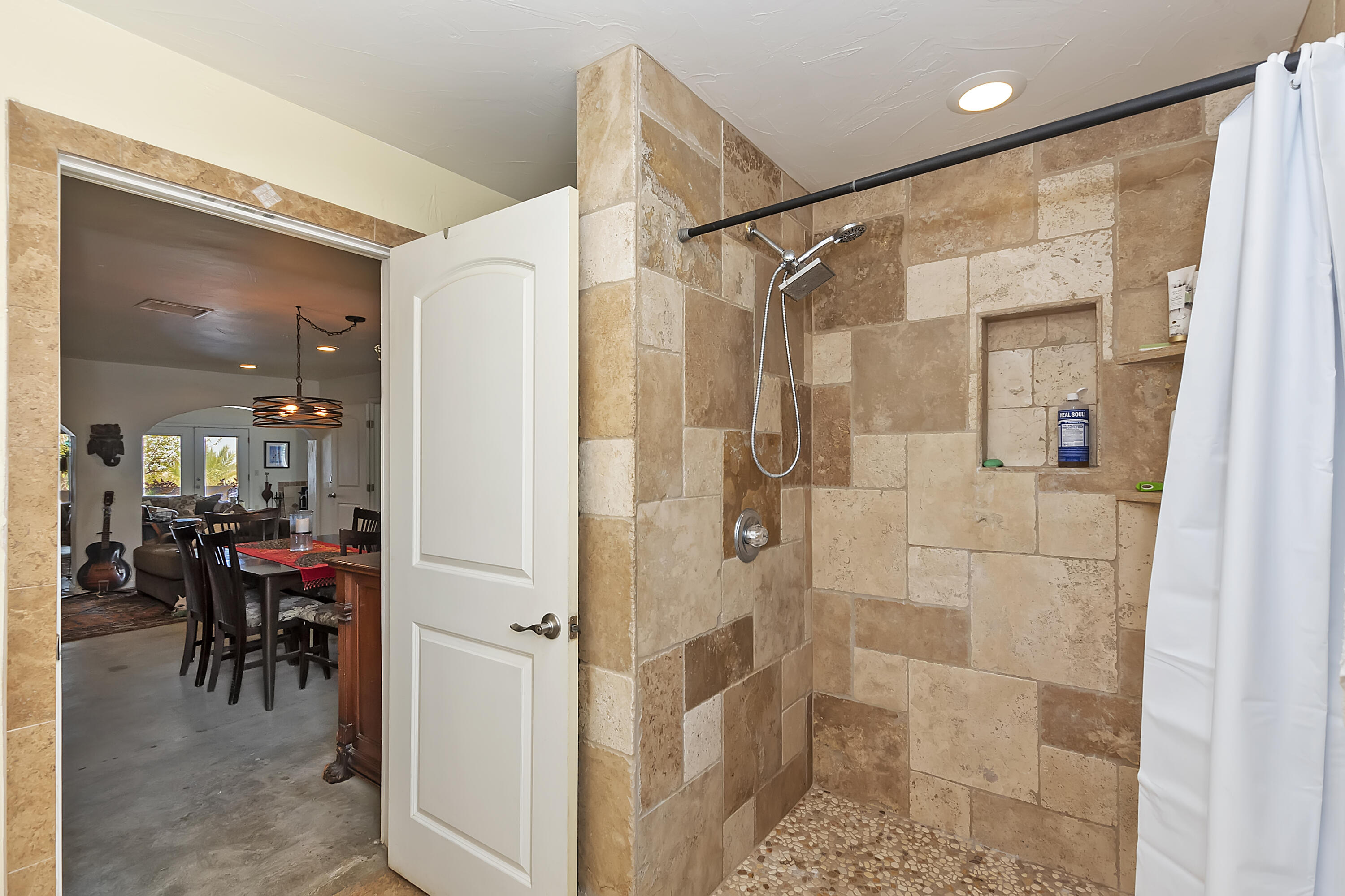73315 Helms Road Desert Hot Springs, CA 92241 - Photo 25 of 41 a bathroom with a glass shower door and a sink