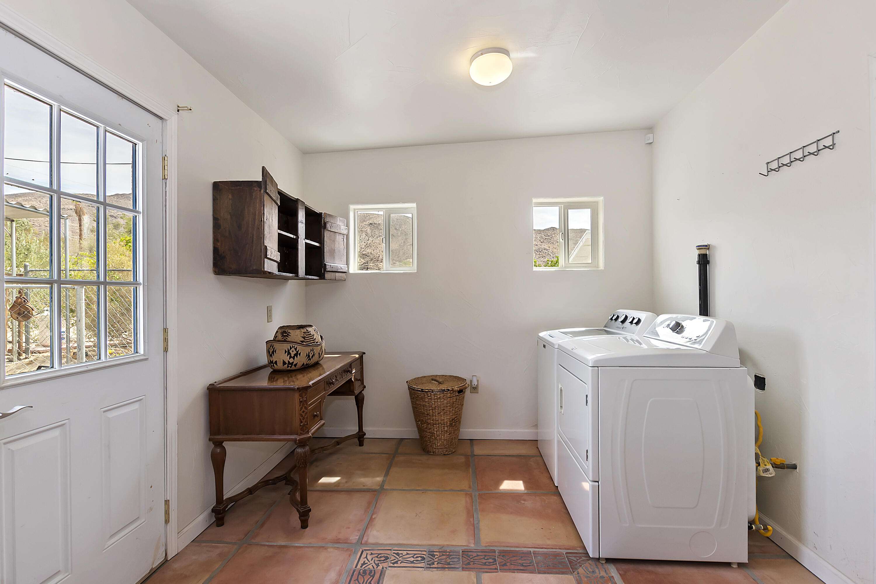 73315 Helms Road Desert Hot Springs, CA 92241 - Photo 30 of 41 a utility room with closet dryer and washer