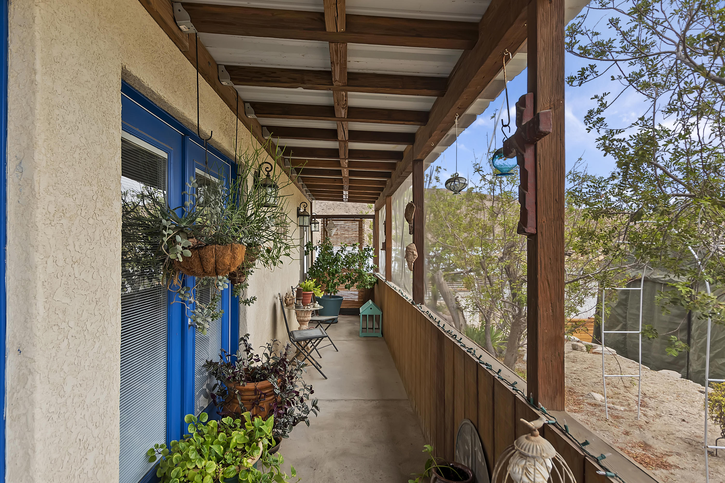 73315 Helms Road Desert Hot Springs, CA 92241 - Photo 31 of 41 a view of a porch with a potted plant