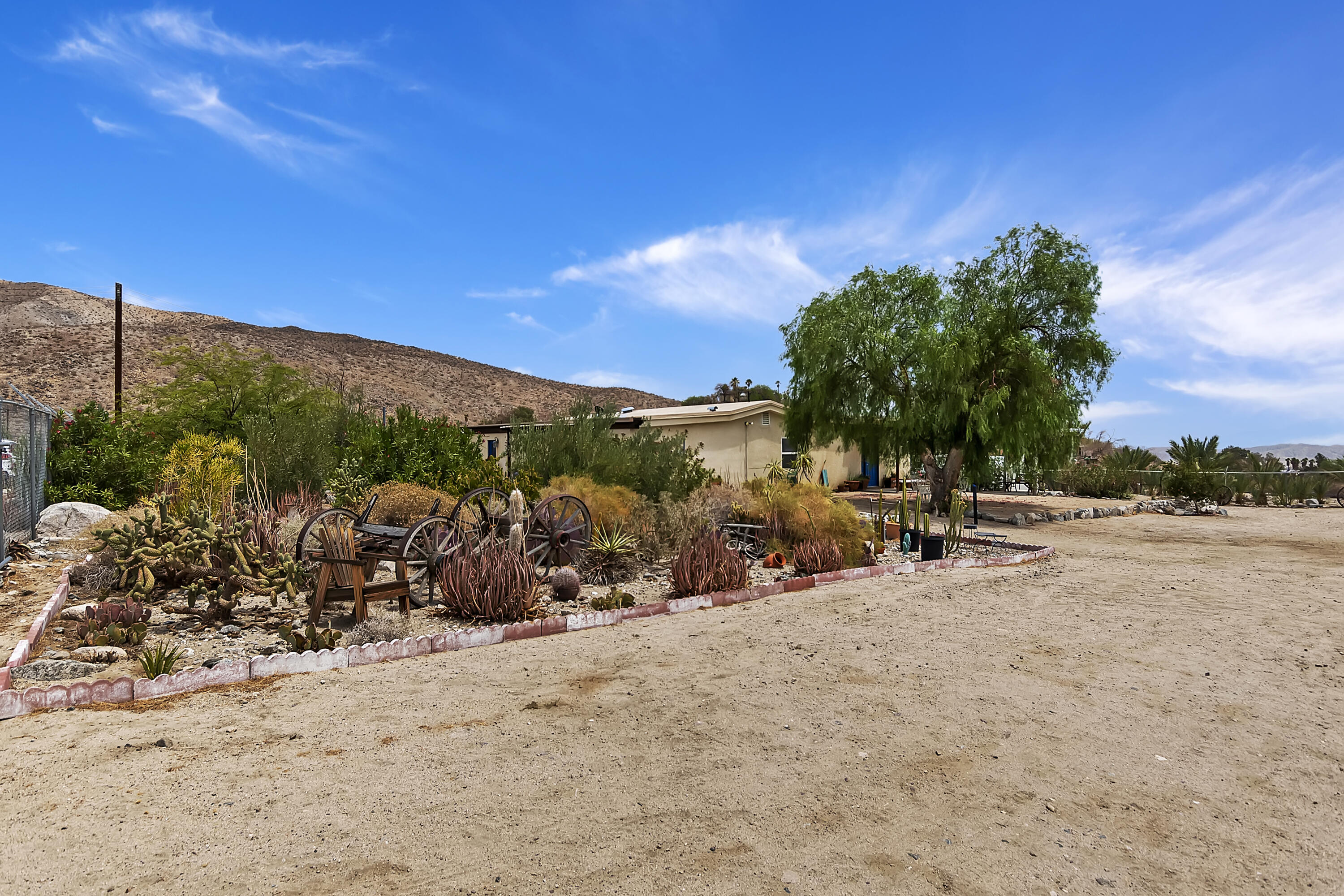 73315 Helms Road Desert Hot Springs, CA 92241 - Photo 33 of 41 a view of a car park in front of the house