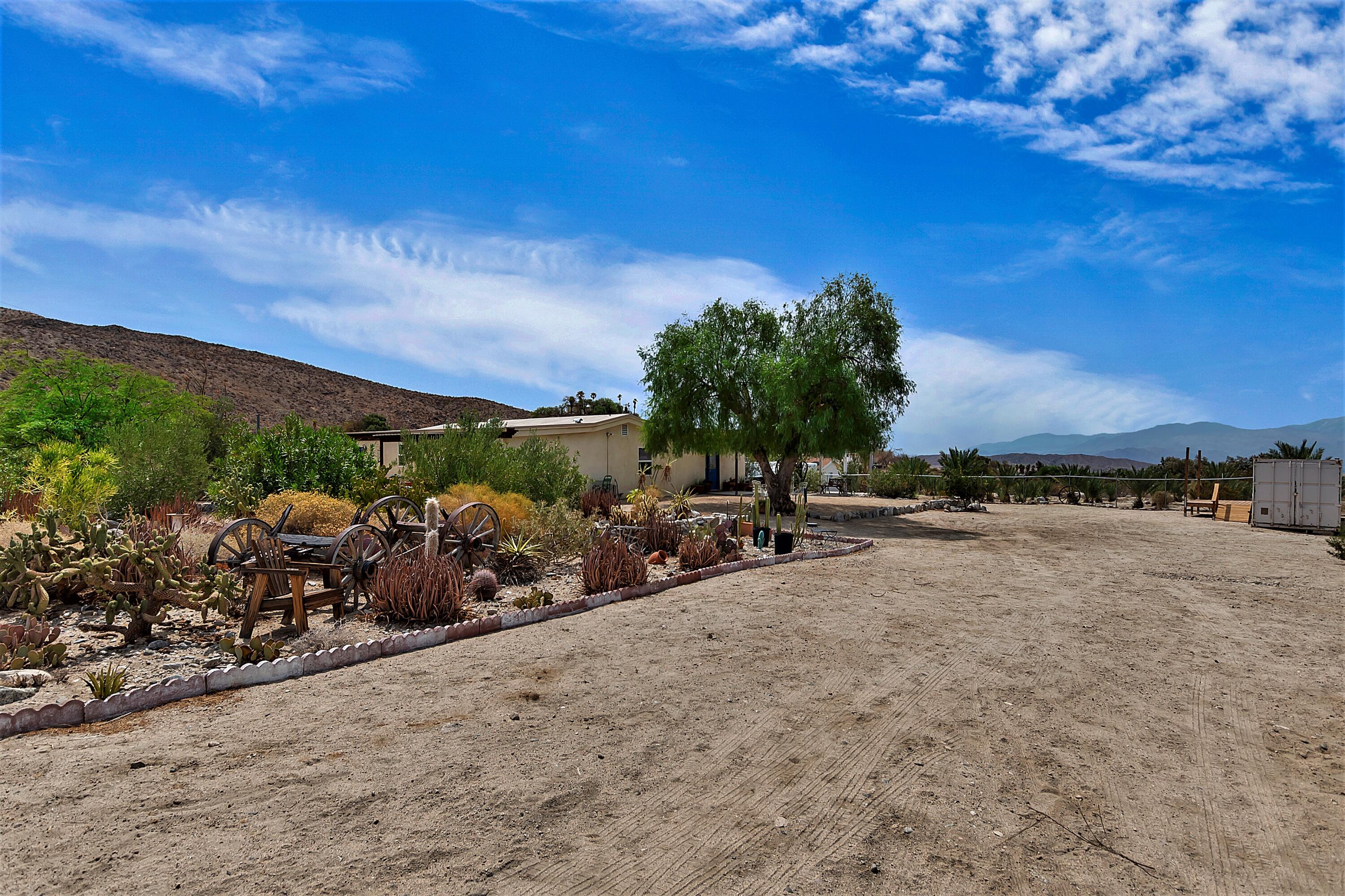 73315 Helms Road Desert Hot Springs, CA 92241 - Photo 34 of 41 a view of a lake with a car parked in a yard