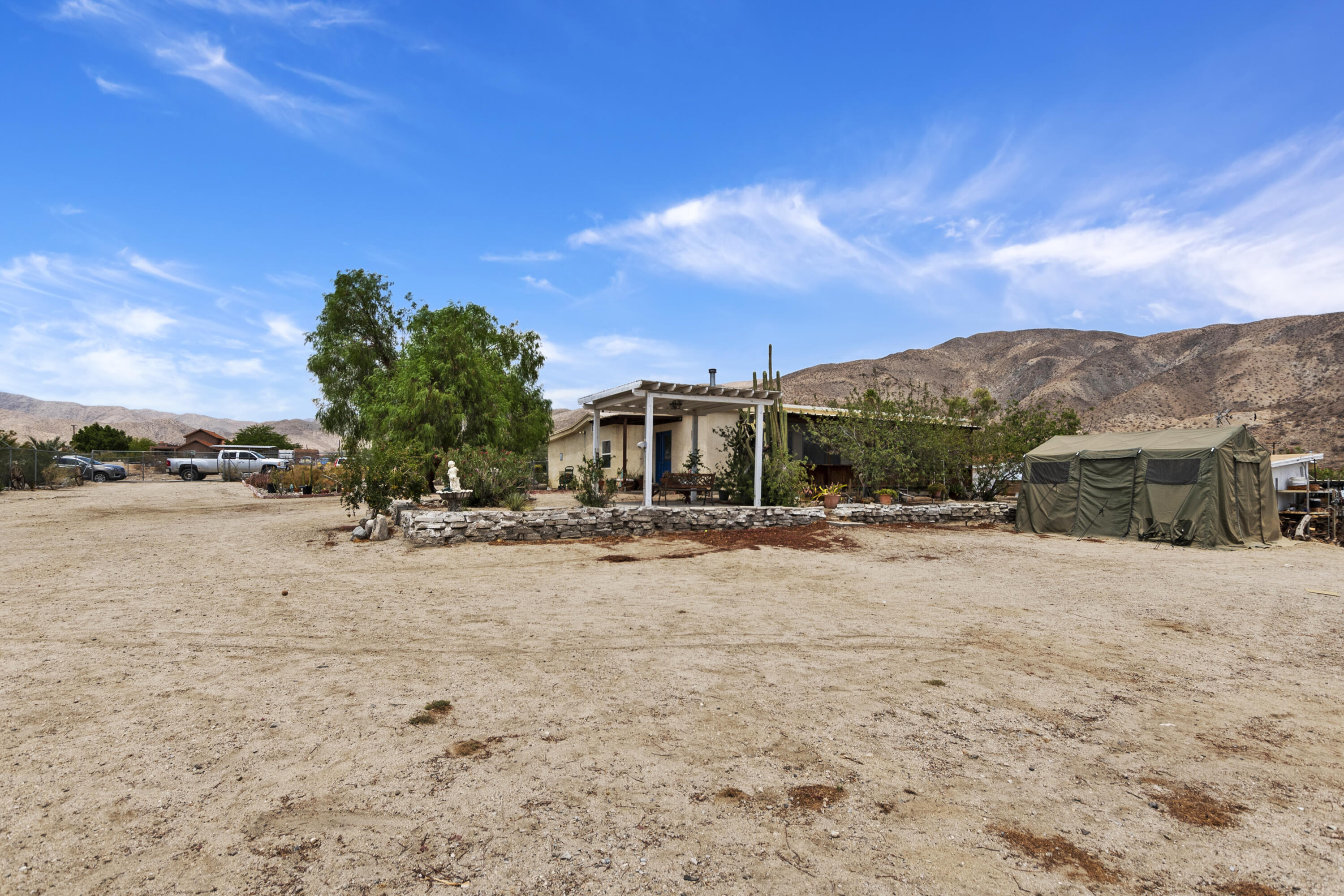 73315 Helms Road Desert Hot Springs, CA 92241 - Photo 36 of 41 a view of a house with a yard