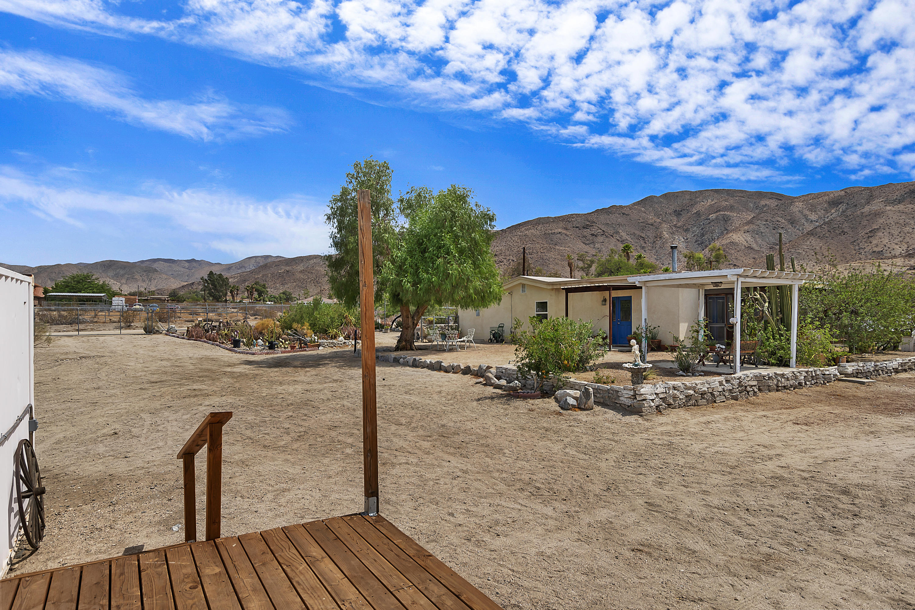 73315 Helms Road Desert Hot Springs, CA 92241 - Photo 38 of 41 a view of a house with backyard and sitting area