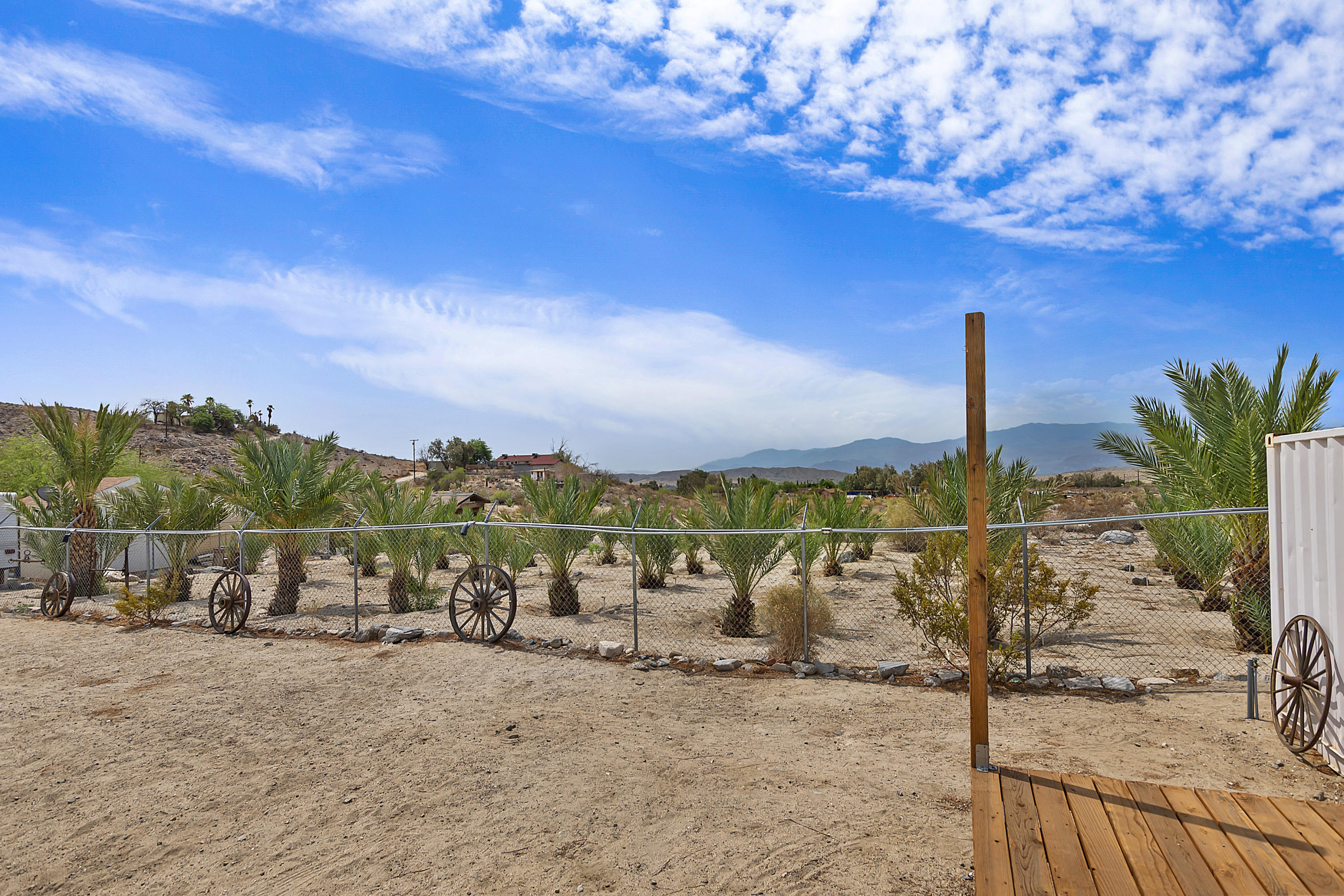 73315 Helms Road Desert Hot Springs, CA 92241 - Photo 39 of 41 a view of a lake with a table under an umbrella