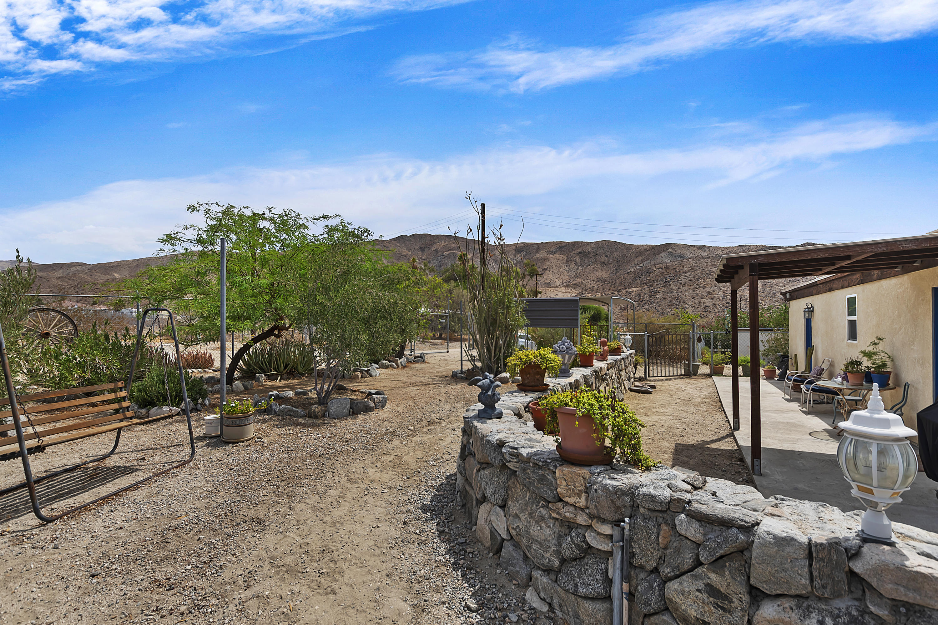 73315 Helms Road Desert Hot Springs, CA 92241 - Photo 6 of 41 a view of a terrace with furniture
