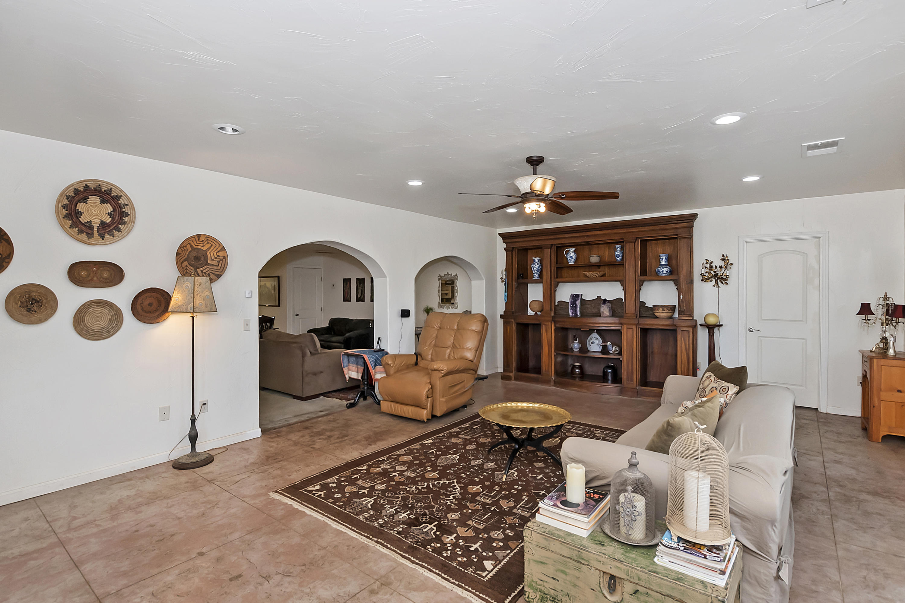 73315 Helms Road Desert Hot Springs, CA 92241 - Photo 7 of 41 a living room with furniture a rug and white walls