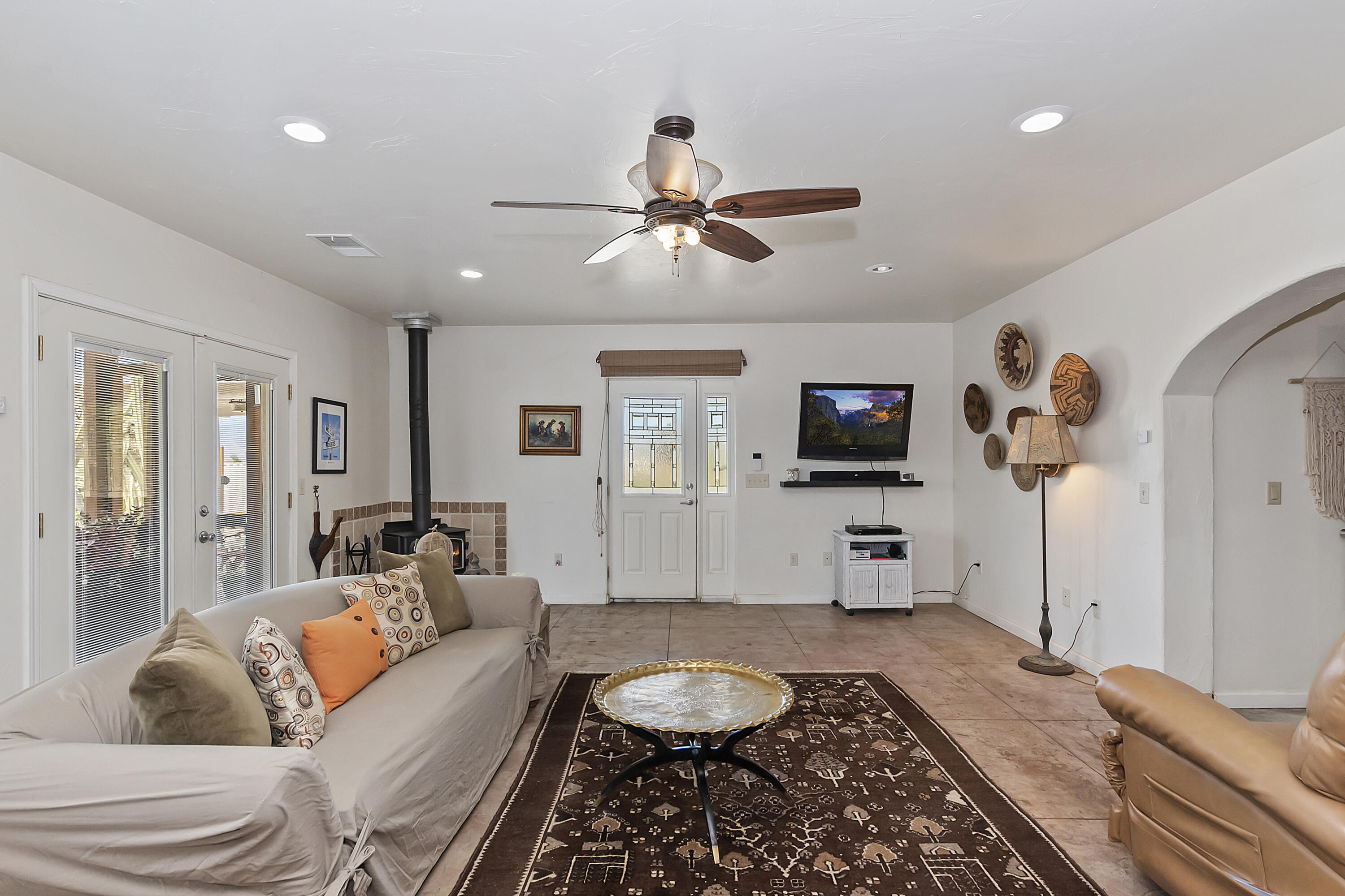 73315 Helms Road Desert Hot Springs, CA 92241 - Photo 10 of 41 a living room with furniture and a flat screen tv