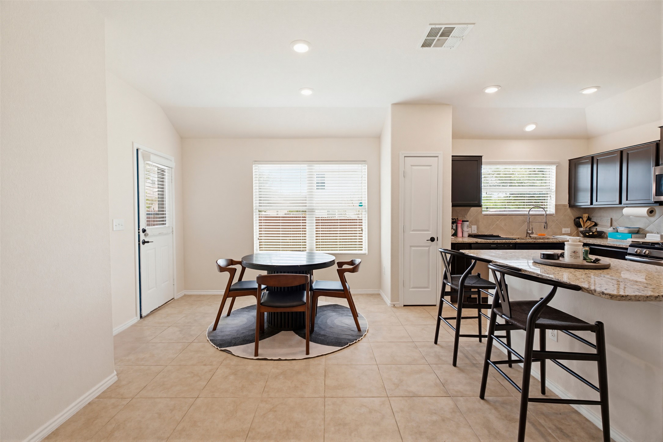 5705 Southerner Way Austin, TX 78747 - Photo 5 of 22 Functional kitchen and dining area with ample space for daily meals and entertaining.