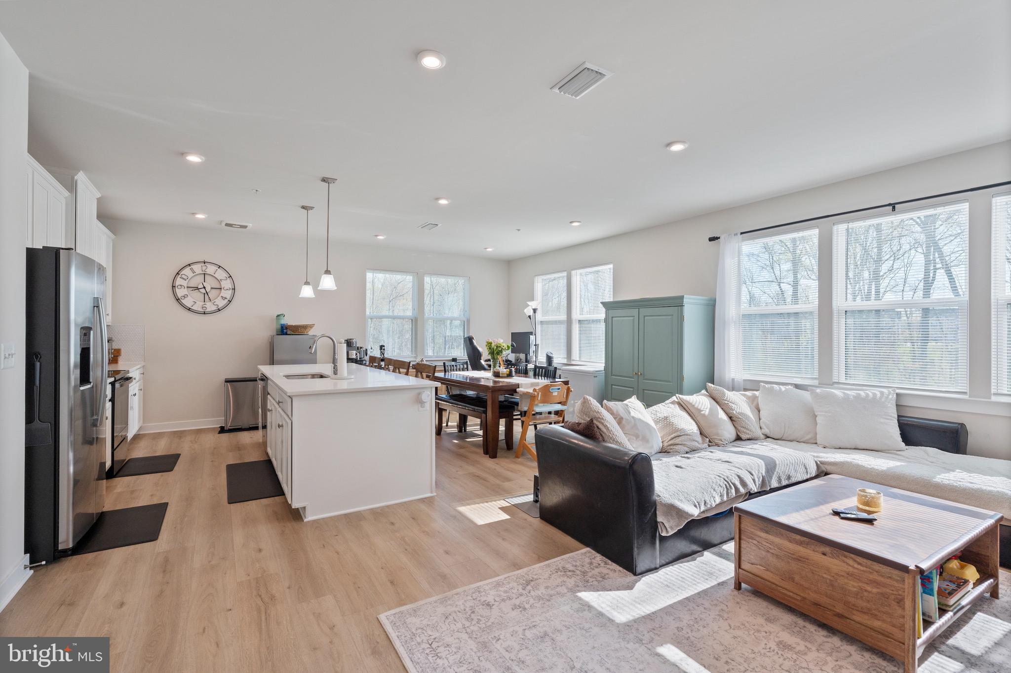 10411 Resort Road, Unit B Ellicott City, MD 21042 - Photo 12 of 36 a living room with furniture and a table
