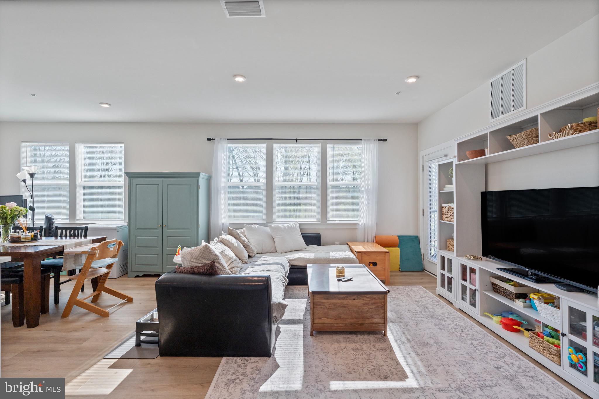 10411 Resort Road, Unit B Ellicott City, MD 21042 - Photo 13 of 36 a living room with furniture and a flat screen tv
