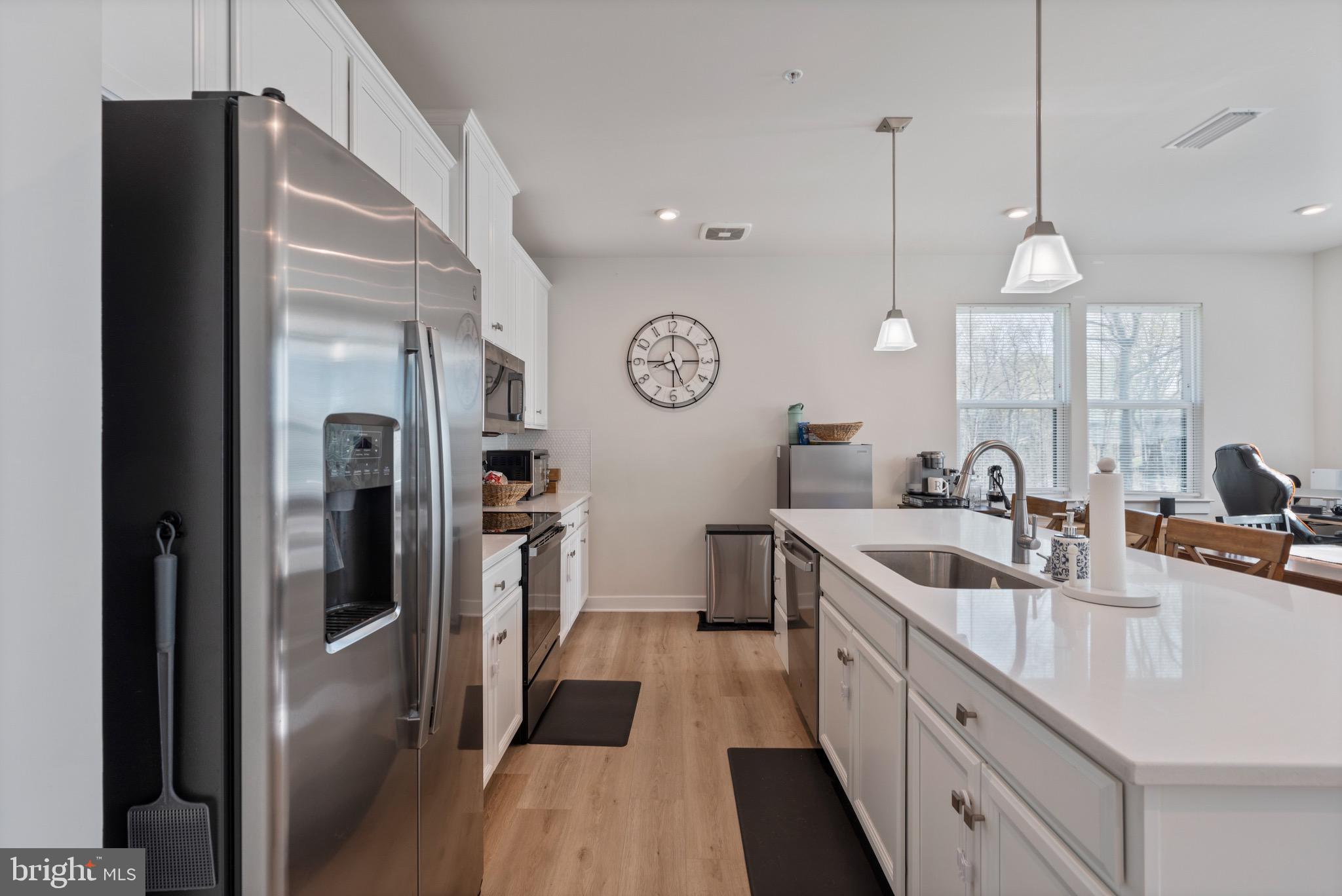 10411 Resort Road, Unit B Ellicott City, MD 21042 - Photo 16 of 36 a large kitchen with a lot of counter space
