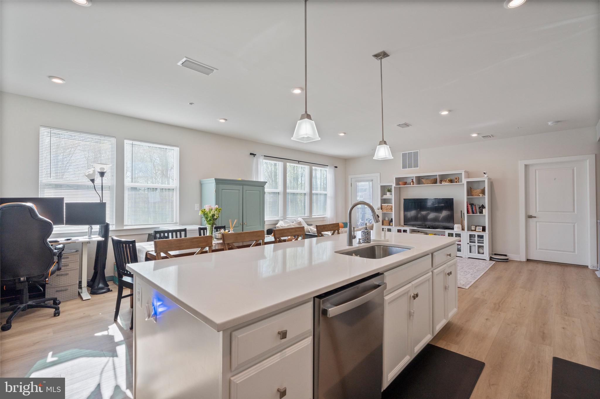 10411 Resort Road, Unit B Ellicott City, MD 21042 - Photo 17 of 36 a kitchen with stainless steel appliances granite countertop a sink a stove and a refrigerator