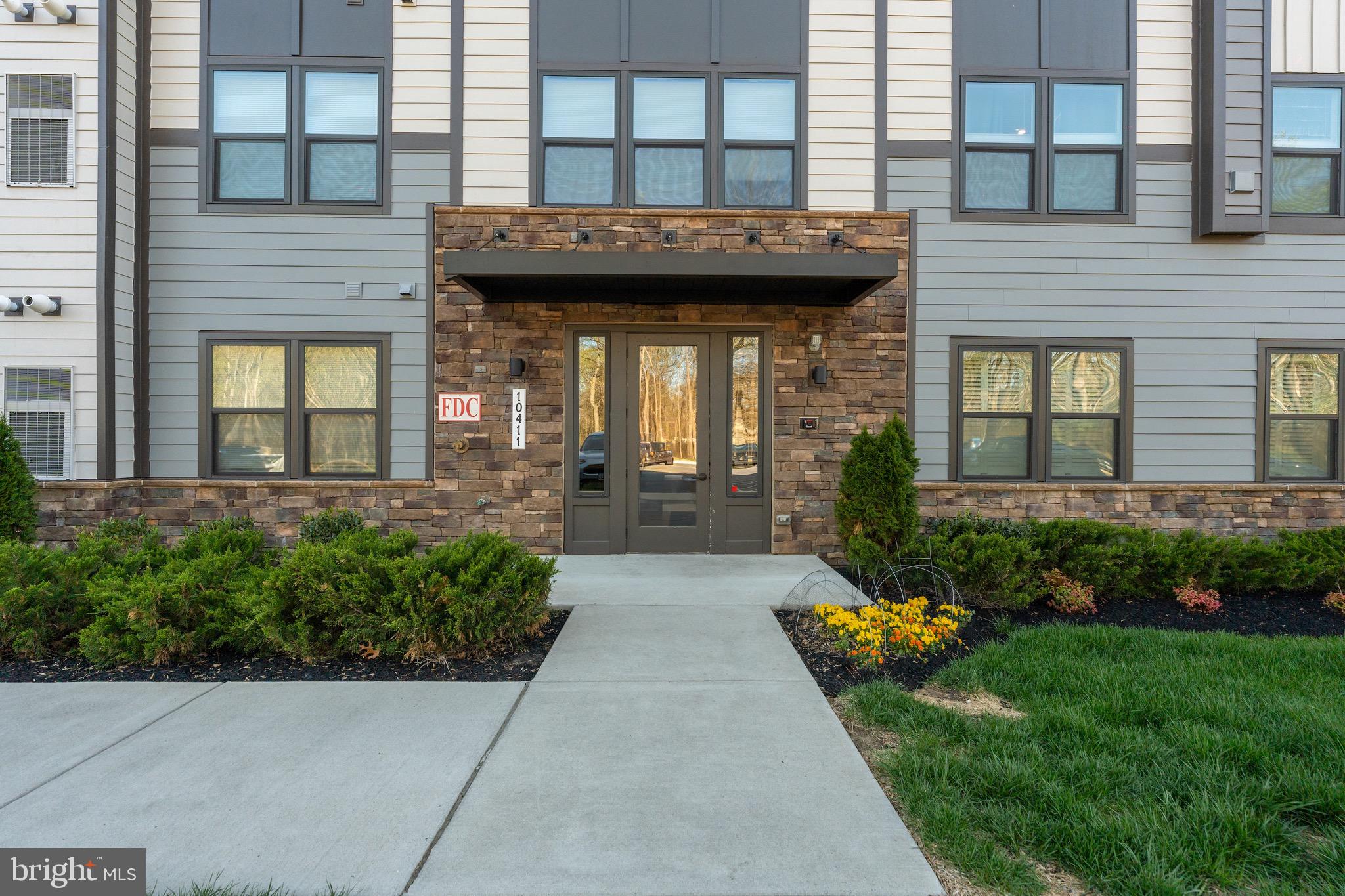 10411 Resort Road, Unit B Ellicott City, MD 21042 - Photo 2 of 36 a view of a brick building with a outdoor space