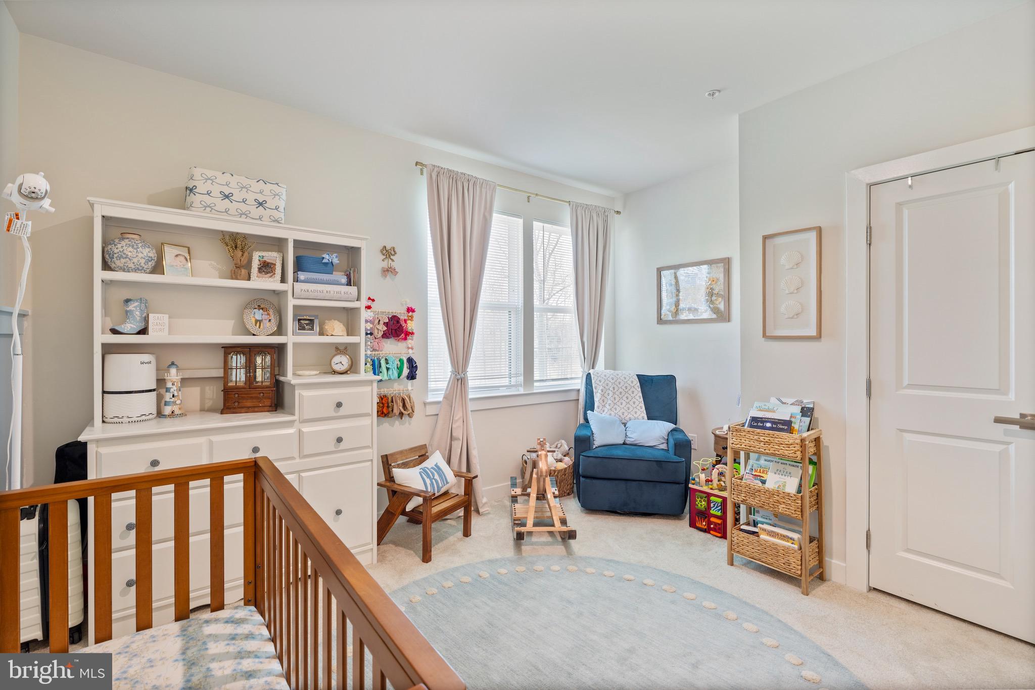 10411 Resort Road, Unit B Ellicott City, MD 21042 - Photo 25 of 36 a bedroom with furniture and a book shelf
